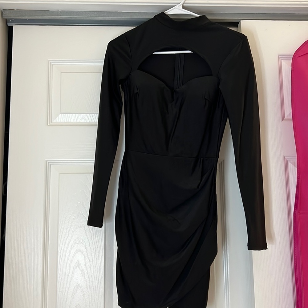 Small black tight dress from fashion nova. Open above chest